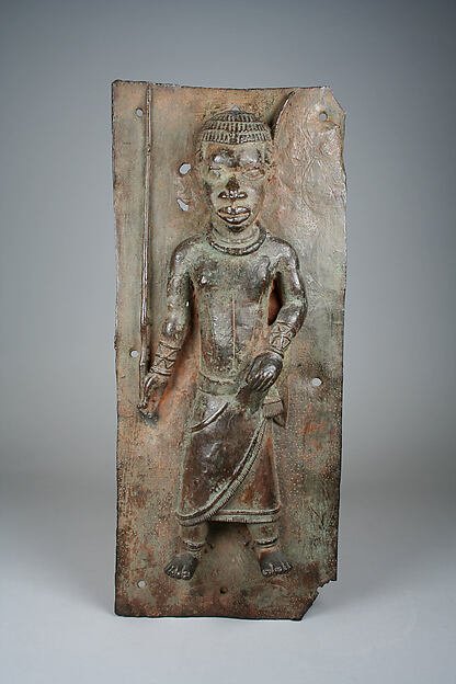 Plaque with court official with magical staff