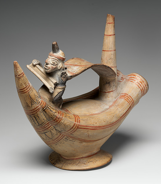 Bottle with a reed boat and paddler