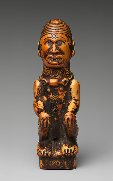 Staff finial with seated woman