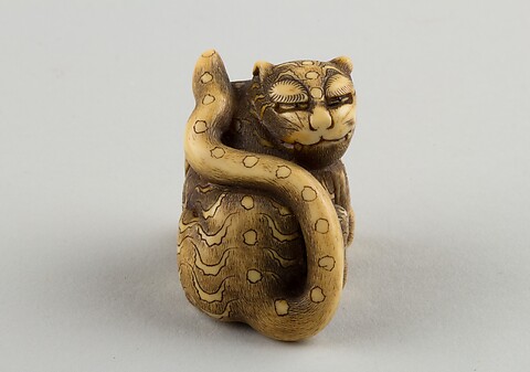 Masatami - Netsuke of a Female Monkey Holding a Nut while her Baby
