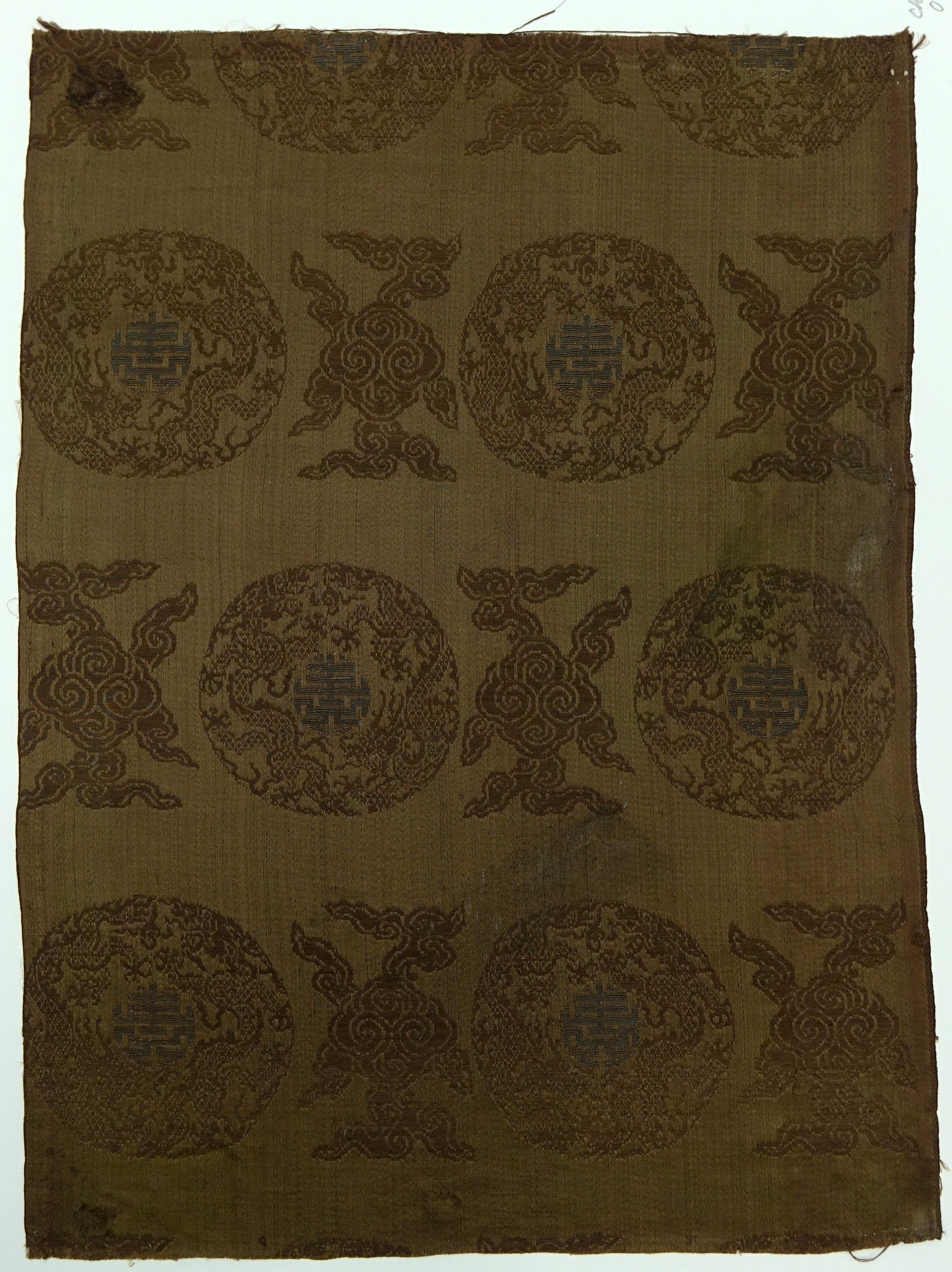 Textile fragment with dragon medallions