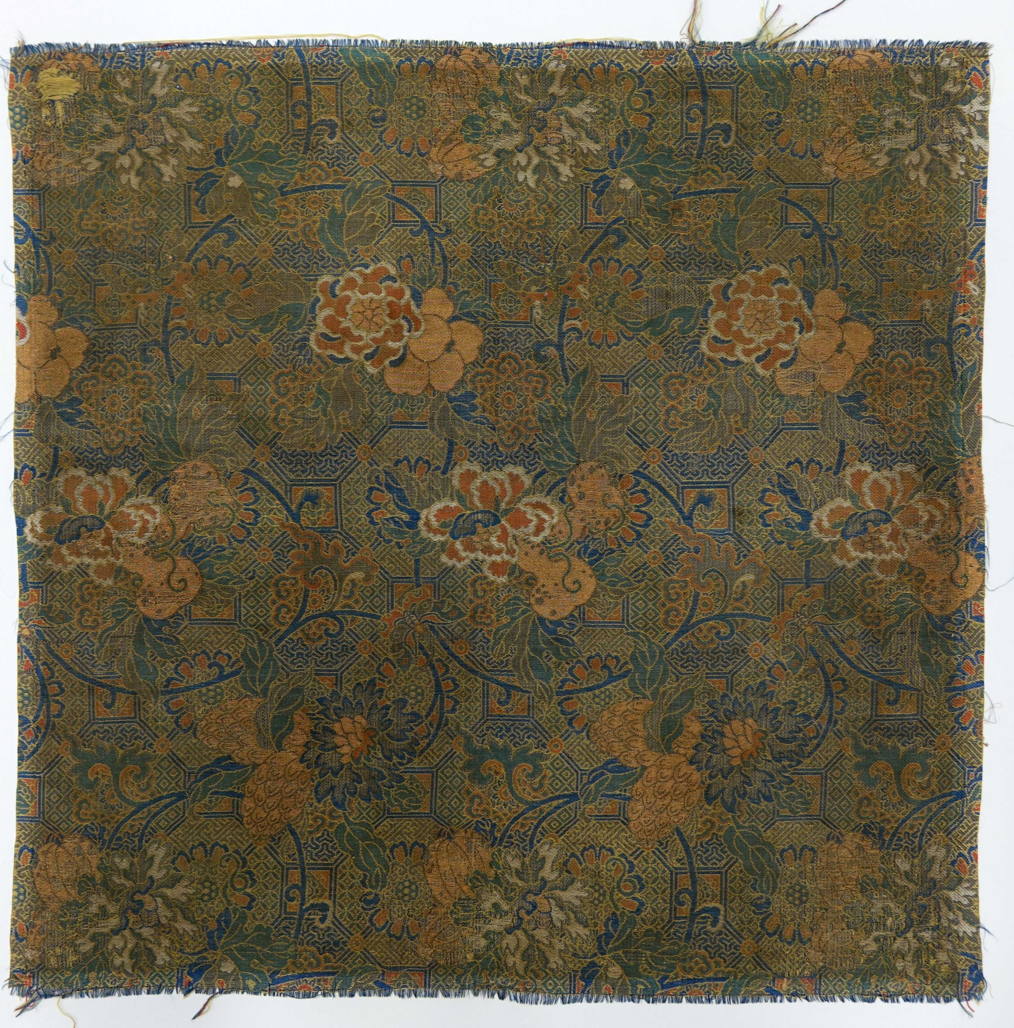 Textile fragment with floral scrolls and geometric pattern