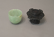 One of pair of cups, Jadeite, emerald-green running to lighter tints, and a few light clouds of creamy white tinged with russet, China