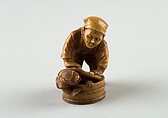 Netsuke of Man Forcing Monkey into a Basket, Ivory, Japan