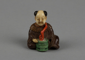 Netsuke of Seated Man with a Flower Pot, Wood and ivory, Japan