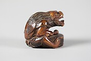 Netsuke of Masked Figure with a Drum, Wood, Japan
