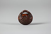 Netsuke in the form of a Nut Containing a Carved Landscape, Wood, Japan