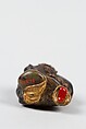 Netsuke, Stone ornamented with gilt and red enamel-inlaid metal eyes, Japan