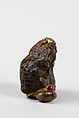 Netsuke, Stone ornamented with gilt and red enamel-inlaid metal eyes, Japan