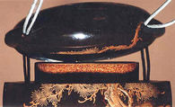 Inrō with Tiger Drinking from a River beside Rocks and Pine Tree, Two cases; lacquered wood with gold and silver togidashimaki-e, hiramaki-e, takamaki-e, cut-out gold foil application on black groundNetsuke: bat; carved walrus ivoryOjime: coral bead, Japan