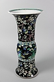Vase with birds and flowers, PPorcelain painted in polychrome enamels over a black ground (Jingdezhen ware, famille noire), wooden stand, China