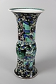 Vase with birds and flowers, PPorcelain painted in polychrome enamels over a black ground (Jingdezhen ware, famille noire), wooden stand, China