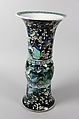 Vase with birds and flowers, PPorcelain painted in polychrome enamels over a black ground (Jingdezhen ware, famille noire), wooden stand, China