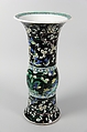 Vase with birds and flowers, PPorcelain painted in polychrome enamels over a black ground (Jingdezhen ware, famille noire), wooden stand, China