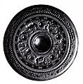 Mirror with Queen Mother of the West, Lord of the East, and mythical creatures, Bronze with black patina, China