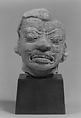 Head of a Grimacing Male Deity, Stucco, Thailand