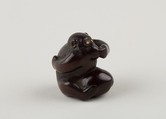 Netsuke of Monkey with One Hand over Mouth, the Other Behind His Back, Miwa, Ebony, ivory inlay, Japan