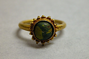 Ring with Green Stone in Circular Mount, Gold with green stone, Indonesia (Java)