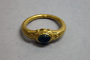 Ring with Green Stone in Circular Setting, Gold with green stone, Indonesia (Java)
