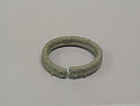One from a Pair of Solid Open Bangles with Two Rows of Concentric Circles, Bronze, Thailand