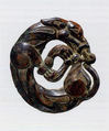 Harness Ornament in the Shape of a Coiled Wolf, Bronze, Northwest China