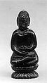 Figure of a Buddha, Amber, China