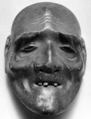 Kyogen mask, Carved wood and brocade bag, Japan