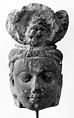 Head of a Bodhisattva, Mottled red and white sandstone, India
