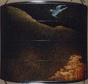Case (Inrō) with Design of Flying Cuckoo in Flight above Pines (obverse); Bonito (Fish) on Bamboo Leaves (reverse), Toyōsai (1772–1845), Black lacquer with sprinkled gold and silver makie and mother-of-pearl
Ojime: bead with openwork design of waves; silver
Netsuke: fish laid on bamboo branch; stained ivory, Japan