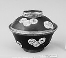 Cup and Cover, White porcelain covered inside with iron red, outside with colored enamel decorations on a black enamel ground, Japan