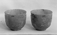 One of pair of cups, Jadeite, emerald-green running to lighter tints, and a few light clouds of creamy white tinged with russet, China