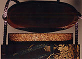 Case (Inrō) with Design of Nonomiya (Shrine in the Fields), from The Tale of Genji, chapter 10, Gold maki-e with black lacquer 
Ojime: bronze with openwork and inlay of water birds on stream 
Netsuke: carved red lacquer, Japan