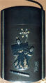 Case (Inrō) with Symbols of Girls' Festival (obverse); Emblems for New Year Festival (reverse), Metal, dark silver metal ground, applied silver and gold metals; Interior: black lacquer and silver metal, Japan