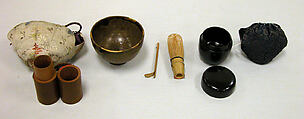 Teabowl and Accessories, Clay, transparent glaze and thick overglaze in spots; accessories consist of black lacquer tea jar, small cylindrical wooden holder with bamboo tea whisk and jointed bamboo spoon; brocade covers for bowl and tea jar; these form a set for a traveler (Karatsu ware), Japan