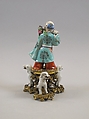 Figure of God of Longevity (Shoulao) and two dogs, Porcelain painted in overglaze polychrome enamels (Jingdezhen ware), European gilt bronze mount, China