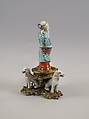 Figure of God of Longevity (Shoulao) and two dogs, Porcelain painted in overglaze polychrome enamels (Jingdezhen ware), European gilt bronze mount, China