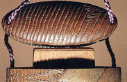 Case (Inrō) with a Fox from the Kyōgen Play "The Fox Hunter" (Tsurigitsune) (obverse); Haystacks and Stream from the Kyōgen Play "Hakuzosu" (reverse), Shibata Zeshin (Japanese, 1807–1891), Gold and colored lacquer on wood
Signed: Zeshin
Ojime: carved wooden dragon (signed: Ichiryūsai Furuta)
Netsuke: ceramic figure of Kaduzōsu (signed: Eiraku), Japan