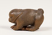 Netsuke of Puppy on Straw Mat Biting String, Wood, black pearls, Japan