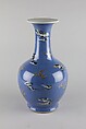 Vase with dragon, Porcelained decorated in low relief with underglaze painting against a blue glaze (Jingdezhen ware), China
