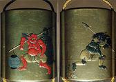 Case (Inrō) with Design of an Oni (Demon) Carrying a Temple Bell and Paper Lantern over His Shoulder (obverse); Oni Carrying Fish Head Stuck on a Pole and Holly Branch (reverse), Lacquer, kinji, gold, red, silver and black hiramakie, takamakie; Interior: silver lacquer and fundame, Japan