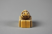 Netsuke of Cat on a Seal-Shaped Base, Ivory; slight brown stain, Japan