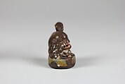 Netsuke, Porcelaneous ware with a finely crackled glaze and an overglaze, Japan