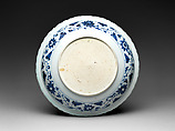 Foliated plate with rocks, plants, and melons, Porcelain painted in underglaze cobalt blue (Jingdezhen ware), China