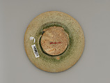 Tea bowl and saucer with lotus decoration, Stoneware with carved decoration under celadon glaze, China