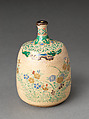 Picnic set with decoration of chrysanthemum and autumn grasses, Sprinkled gold and silver maki-e on red lacquer cabinet; sprinkled gold and black lacquer on red lacquer boxes; Kyoto-ware sake bottle (glazed stoneware with enamels), Japan