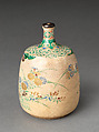 Picnic set with decoration of chrysanthemum and autumn grasses, Sprinkled gold and silver maki-e on red lacquer cabinet; sprinkled gold and black lacquer on red lacquer boxes; Kyoto-ware sake bottle (glazed stoneware with enamels), Japan