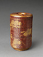 Picnic set with decoration of chrysanthemum and autumn grasses, Sprinkled gold and silver maki-e on red lacquer cabinet; sprinkled gold and black lacquer on red lacquer boxes; Kyoto-ware sake bottle (glazed stoneware with enamels), Japan