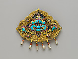 Woman’s Brooch with Monster Mask, Gilt silver, rubies, sapphires, emeralds, coral, pearls, mother-of-pearl, and turquoise, Nepal