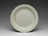 Chrysanthemum-petal dish with tortoise, cranes, and flowers, Porcelain with impressed design under glaze (Ding ware), China