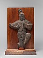 Musician playing a drum, Limestone, China